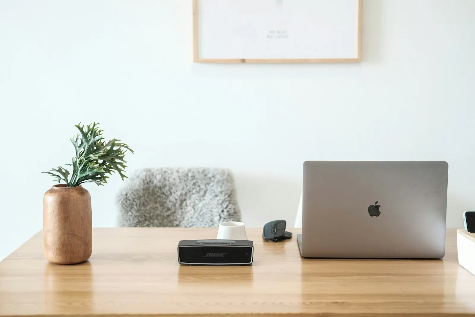 minimal home office desk with laptop, asset-light lifestyle