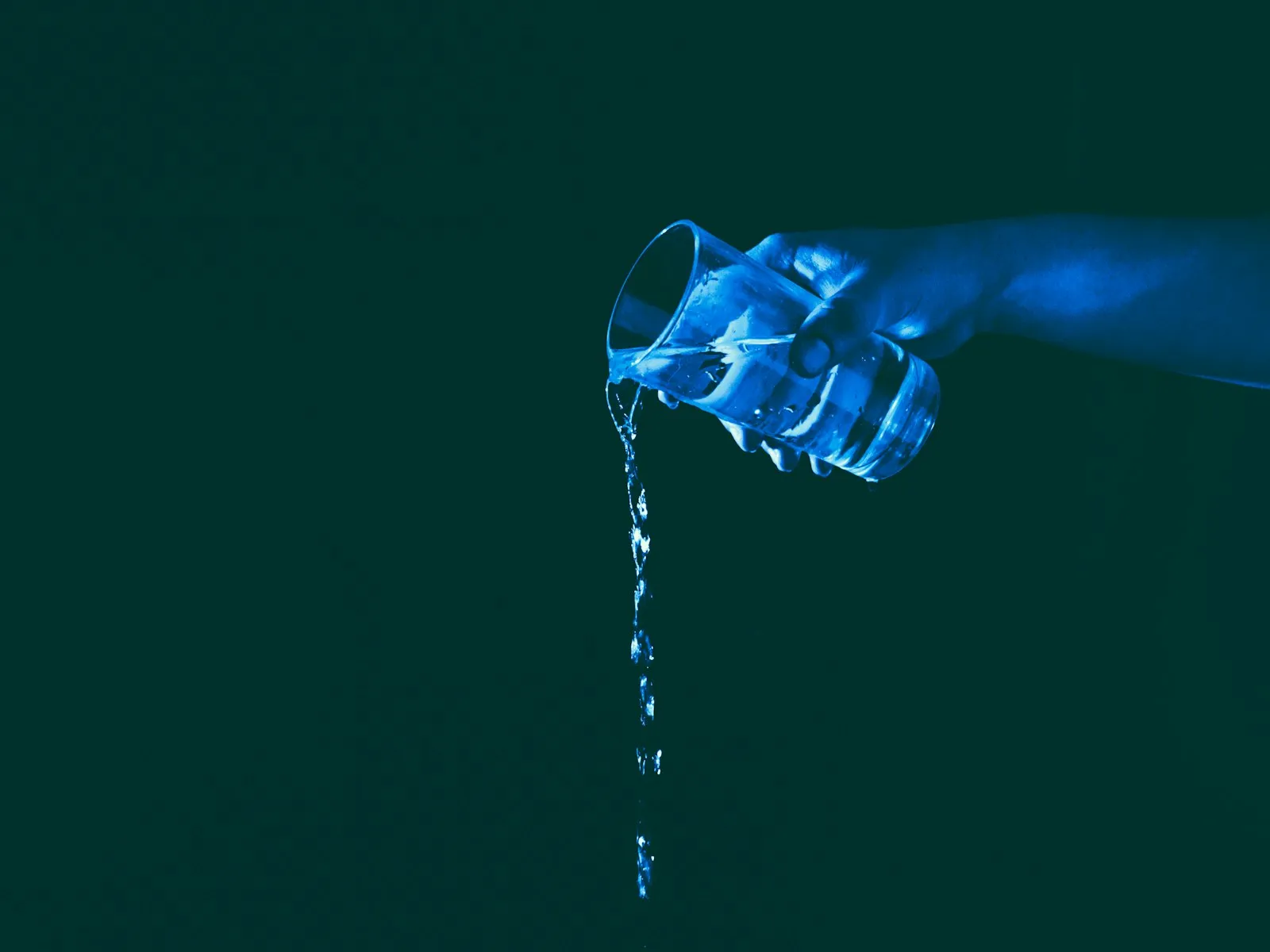 water ionizer machine pouring water into glass