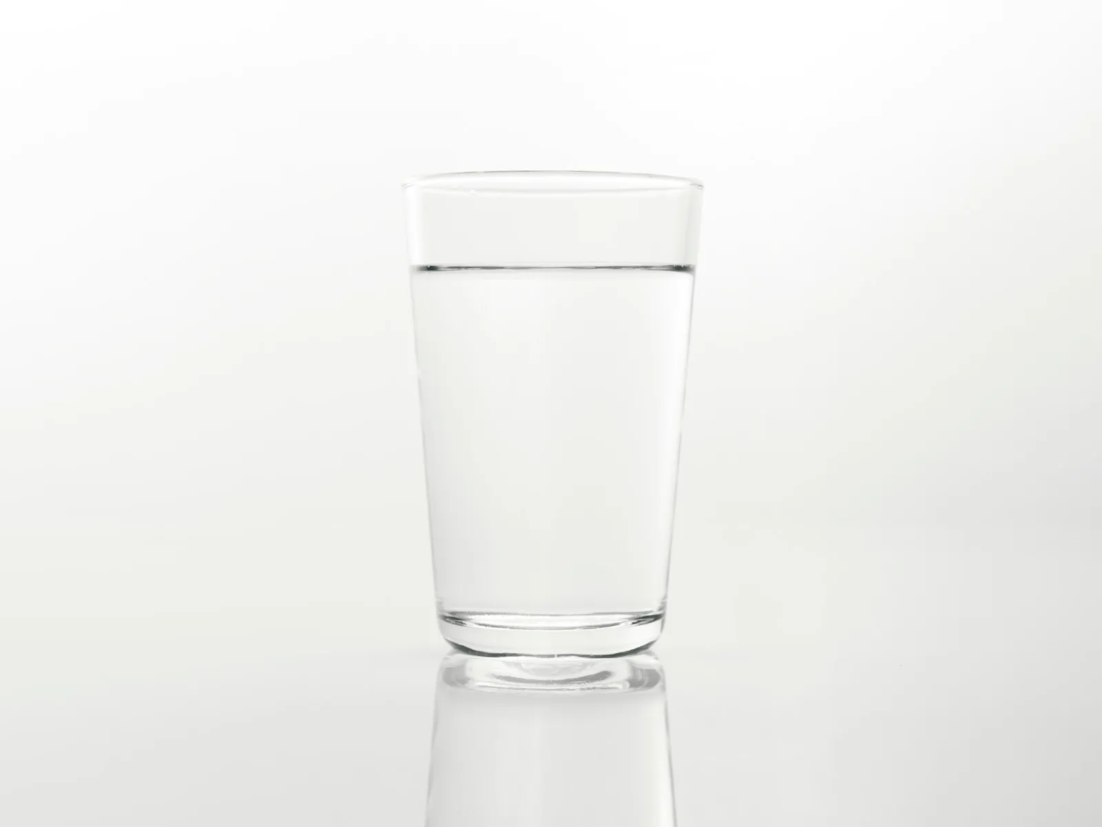 glass of alkaline water with ph test in thai kitchen