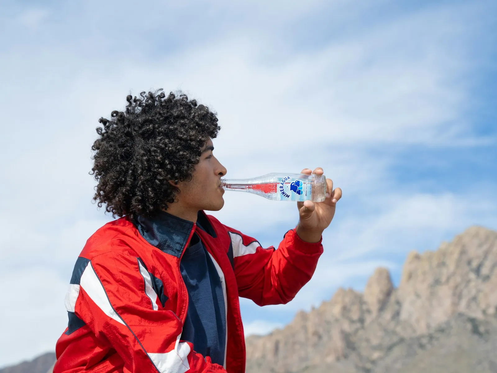 thai man drinking water after outdoor exercise