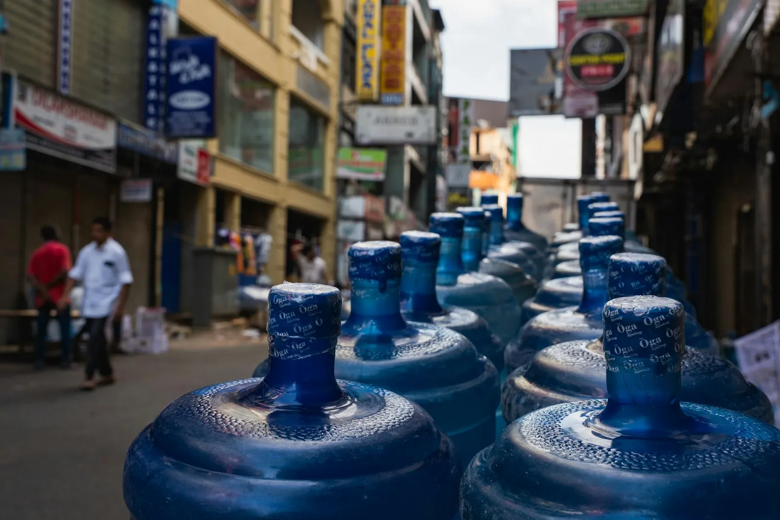 thai shop owner with water machine small business